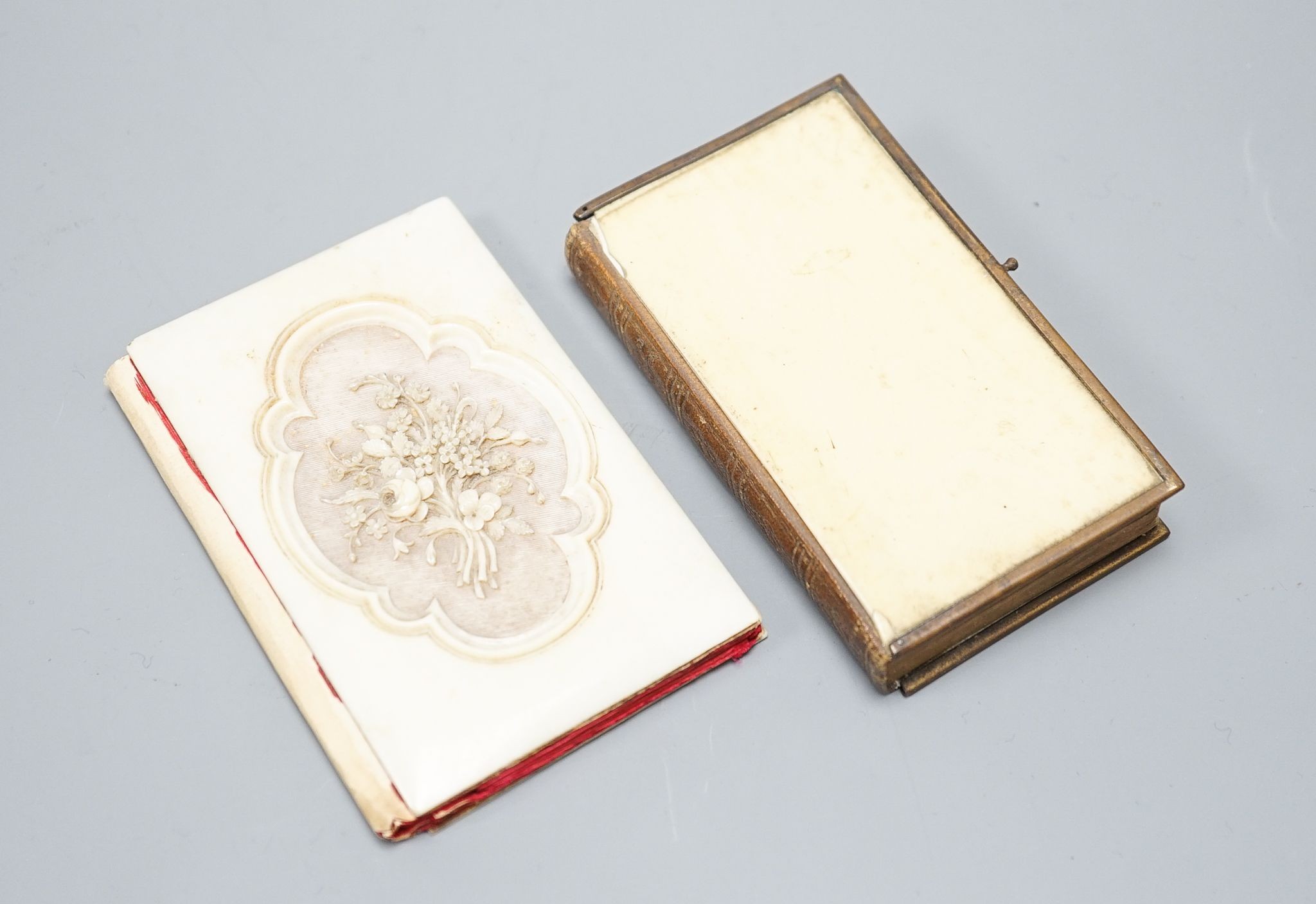 A carved ivory card case and an ivory-bound church missal, Card case 10 cms high.